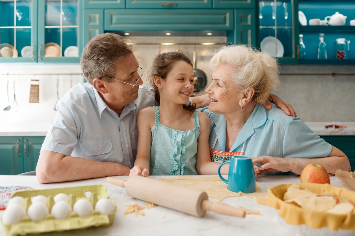 Grandparents cooking with kid